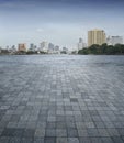 An empty scene of a stone tile floor and Bangkok city