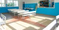 Empty school canteen with white tables and chairs Royalty Free Stock Photo