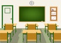 Empty school classroom with blackboard