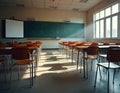 Empty school classroom with desks and chairs arranged facing green chalkboard. Sunlight streams through large windows creating Royalty Free Stock Photo