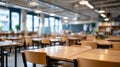 Empty school classroom with desks and chairs set for use. The light and shadows create a welcoming back to school scene Royalty Free Stock Photo