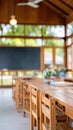 Empty school classroom with desks and chairs set for use. The light and shadows create a welcoming back to school scene Royalty Free Stock Photo
