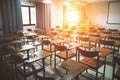 Empty school classroom with many wooden chairs