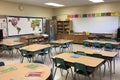 Empty school classroom with wooden desks and board. Generative AI Royalty Free Stock Photo