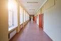 An empty school corridor stretching into the future. The concept of holidays, quarantine, evacuation Royalty Free Stock Photo