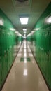 Empty school hallway with green lockers Royalty Free Stock Photo