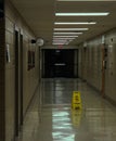 Empty School Hallway With Wet Floor Sign Royalty Free Stock Photo