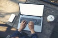 Empty Screen laptop Blogger Woman hands typing computer keyboard. Close up women hands using laptop sitting at coffee shop garden Royalty Free Stock Photo