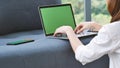 Empty Screen laptop Blogger Woman hands typing computer keyboard. Close up women hands using laptop sitting at sofa in living room Royalty Free Stock Photo