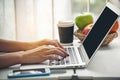 Empty Screen laptop Blogger Woman hands typing computer keyboard. Close up women hands using laptop sitting at sofa in living room Royalty Free Stock Photo