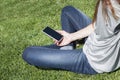 Empty screen phone woman on grass