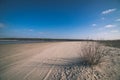 empty sea beach with sand dunes - vintage retro film look Royalty Free Stock Photo