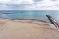 Empty sea coast in winter, concrete piers in the sea Royalty Free Stock Photo