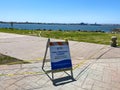 Empty sea port of San Diego with informative signage during COVID-19 pandemic.