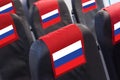 Empty seat in plane with Russian Flag. Travel, transportration and sanctions against Russia concept