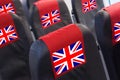 Empty seat in plane with UK Flag. Travel, flight and transportration in United Kingdom concept Royalty Free Stock Photo