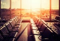 Empty seats in an airport departure hall at sunset. Royalty Free Stock Photo