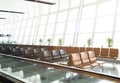 Empty seats at the airport departure terminal lounge waiting area Royalty Free Stock Photo