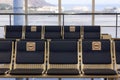 Empty seats at airport terminal with no seating stickers Royalty Free Stock Photo