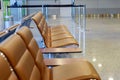 Empty seats bench in the airport hall near departure gate at international airport Royalty Free Stock Photo