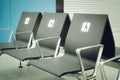 Empty seats for disabled people in the waiting room at the airport. Royalty Free Stock Photo