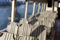 Empty seats on a NYC Ferry lit by the summer afternoon sun