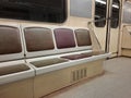 Empty seats without passengers in an empty subway car moving through tunnel Royalty Free Stock Photo