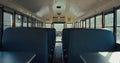 Empty seats placed school bus interior closeup. Safety transport concept. Royalty Free Stock Photo