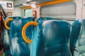 Empty seats in regional train with view through window in Europe. Seats in a train in a row Royalty Free Stock Photo