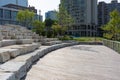 Stone Seating on the Riverwalk along the South Branch of the Chicago River in Downtown Chicago with Skyscrapers