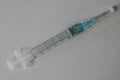 Empty seringe with blue needle Royalty Free Stock Photo