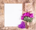 Empty sheet of paper, heart and flowers. Bouquet of violets and letter. Empty page.