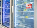 Empty shelf of frozen food in supermarket