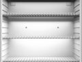 Empty shelves in fridge Royalty Free Stock Photo