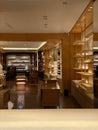 Empty shelves of Louis Vuitton store with no customers nor sellers inside during