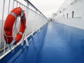 An empty ship deck with a lifebuoy