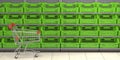 Empty shopping cart and empty fruit plastic crates on supermarket shelf Royalty Free Stock Photo