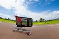 Empty shopping cart at parking lot of supermarket Royalty Free Stock Photo