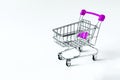 Empty shopping cart on a white background close up