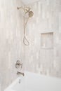 A shower with brown subway tiles and gold faucet. Royalty Free Stock Photo