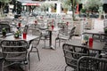 Empty sidewalk cafe in a square in the city of Arnhem in summer