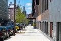 Empty Sidewalk in Long Island City Queens with a view of the Empire State Building in the distance