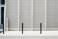 Empty sidewalk with modern building background with closed venetian blinds Royalty Free Stock Photo