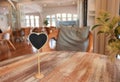 Empty sign on wooden table in coffeehouse