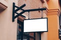 Empty signage and blank mock up hanging on street with copy space Royalty Free Stock Photo