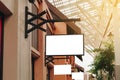 Empty signage and blank mock up hanging on street with copy space Royalty Free Stock Photo