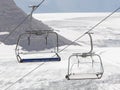 Empty ski lift above snow Royalty Free Stock Photo