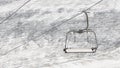 Empty ski lift above snow Royalty Free Stock Photo