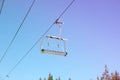 Empty ski lift against blue sky, ski season concept Royalty Free Stock Photo