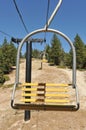 Empty ski lift chairs in a row Royalty Free Stock Photo